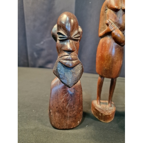 121 - Four pieces of wooden Africana.  Three males and one female