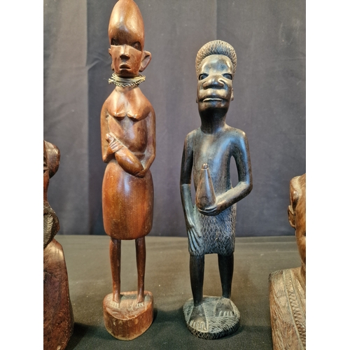 121 - Four pieces of wooden Africana.  Three males and one female