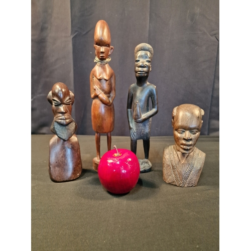 121 - Four pieces of wooden Africana.  Three males and one female