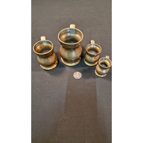 2 - Four brass pint and Gill measuring jugs.
1/4, 1/2 and 1 Gill and a 1/2 pint.