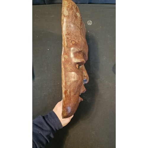 5 - A large wall mounted hand carved tribal head mask. 
Approximately 45x25cm