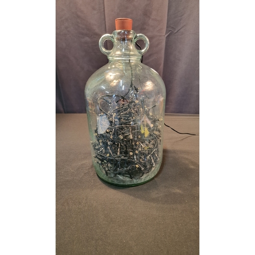 9 - A demijohn with stopper.  Comes with string lights inside.  Approximately 33cm H