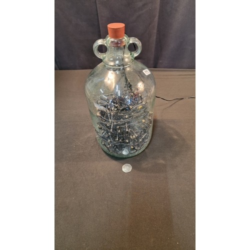 9 - A demijohn with stopper.  Comes with string lights inside.  Approximately 33cm H