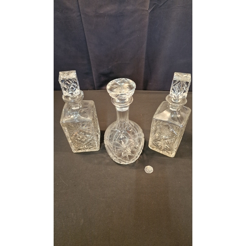 10 - Two lead crystal decanters and cut crystal decanter.