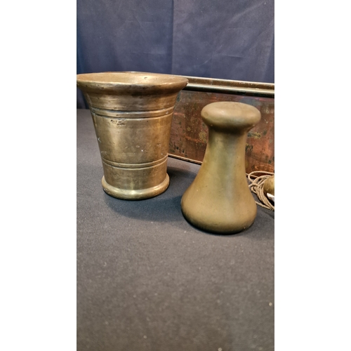 13 - A brass Mortar, 4lb Avery weight, a copper and brass Planter, a brass plumb Bob and two brass bells.