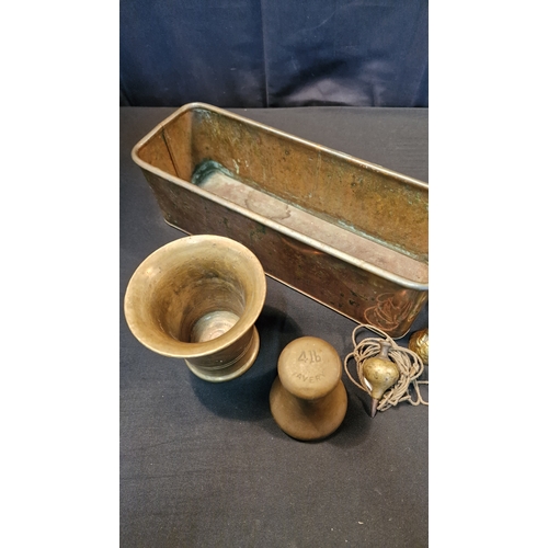 13 - A brass Mortar, 4lb Avery weight, a copper and brass Planter, a brass plumb Bob and two brass bells.