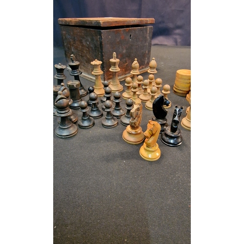 16 - A vintage wooden Staunton Style chess and draft set in wooden store box