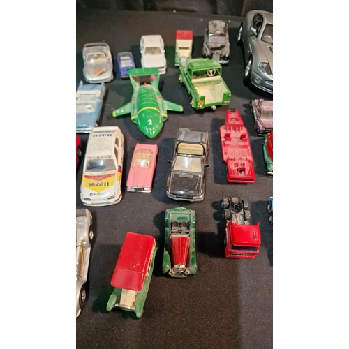 35 - A collection of 24 Corgi, matchbox and various other brands of car trucks and vans