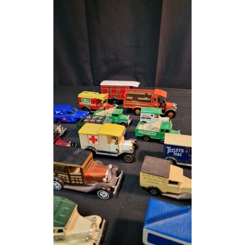 36 - A collection of 27 various branded advertising vans by Lledo, corgi and Days Gone