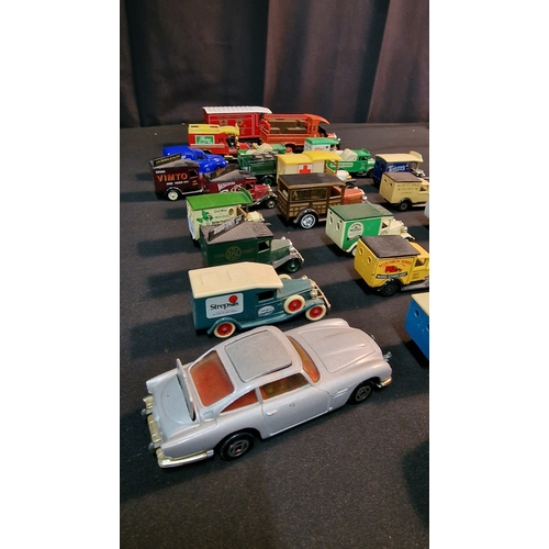 36 - A collection of 27 various branded advertising vans by Lledo, corgi and Days Gone