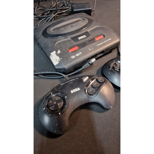 37 - A SEGA mega drive console with two controllers