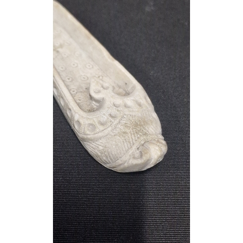 44 - A pair of hand carved stone oriental shoes