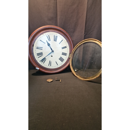 49 - A large Ansonia Clock Company New York Wall Clock. With key. Approximately 42cm D