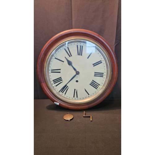 49 - A large Ansonia Clock Company New York Wall Clock. With key. Approximately 42cm D