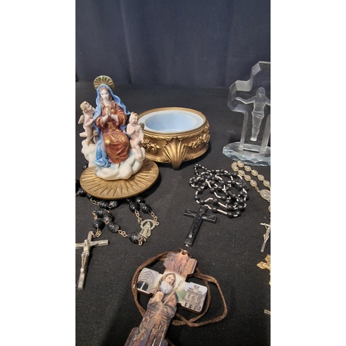 51 - A selection of religious items including 3 sets of rosary beads, and crucifixes