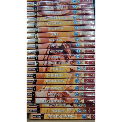 59 - A large collection of 99 John Wayne DVDs.