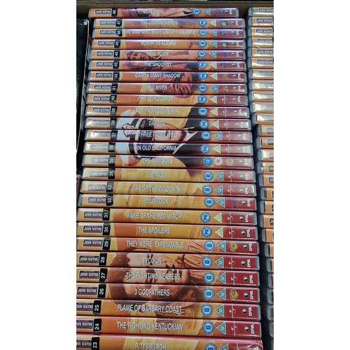 59 - A large collection of 99 John Wayne DVDs.