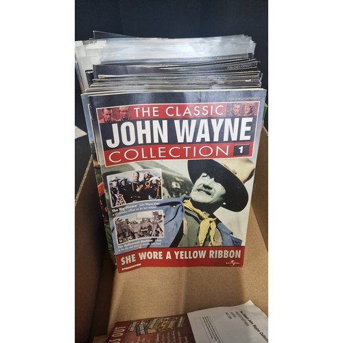 59 - A large collection of 99 John Wayne DVDs.