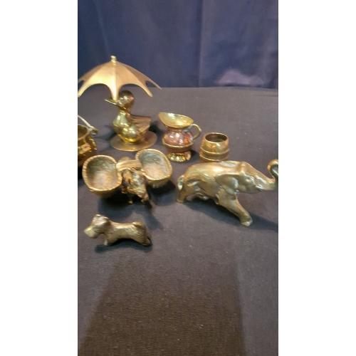 67 - An assortment of miniature brasses.