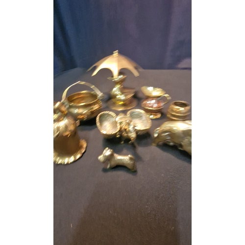 67 - An assortment of miniature brasses.