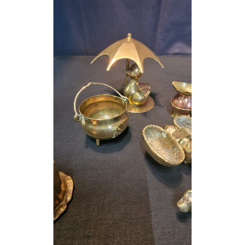 67 - An assortment of miniature brasses.