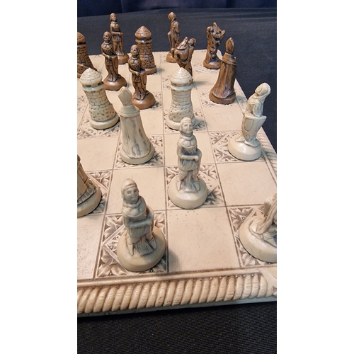 76 - A medieval style chess set and board in resin.