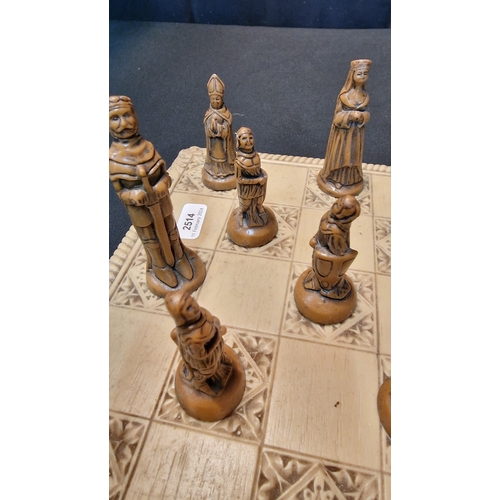 76 - A medieval style chess set and board in resin.