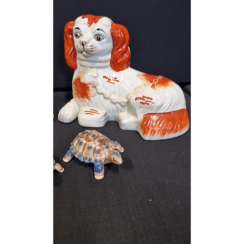 78 - A pair of reproduction Victorian Staffordshire King Charles Spaniels and four Wade Minitures