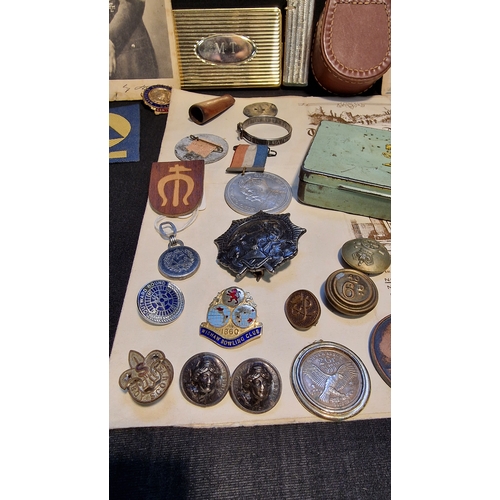 88 - A collection of vintage items including Militaria, pins, cap badges, buttons, Rhodia no.3 tobacco ti... 