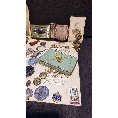 88 - A collection of vintage items including Militaria, pins, cap badges, buttons, Rhodia no.3 tobacco ti... 