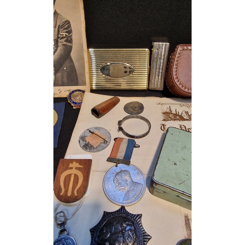 88 - A collection of vintage items including Militaria, pins, cap badges, buttons, Rhodia no.3 tobacco ti... 