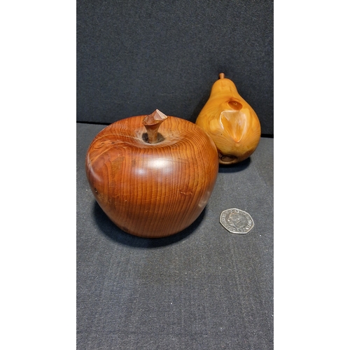 91 - A three piece hand turned set.  Yew wood Apple and pear and an oak table lighter