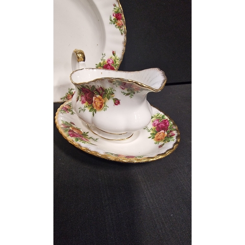 103 - Royal Albert Old Country Rose service.  Includes 8 dinner plates 26cm D, gravy boat and plate and a ... 