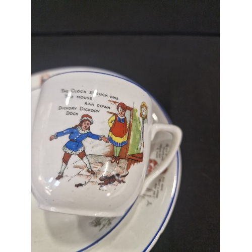 123 - A vintage Palissy nursery rhyme set. Includes  tea cup and saucer with bowl