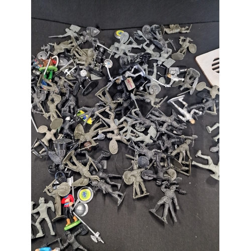 124 - A collection of various Plastic table top gaming knight Figures and accessories.