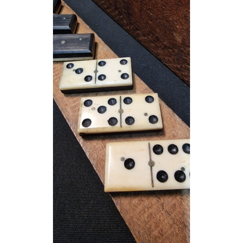 135 - A vintage Ebony and Bone domino set