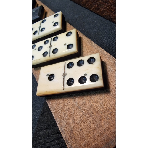 135 - A vintage Ebony and Bone domino set