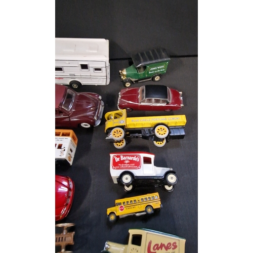 151 - A selection of cars, trams, buses and trucks by Days Gone, Lledo and matchbox.