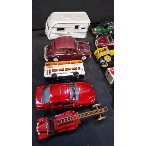 151 - A selection of cars, trams, buses and trucks by Days Gone, Lledo and matchbox.