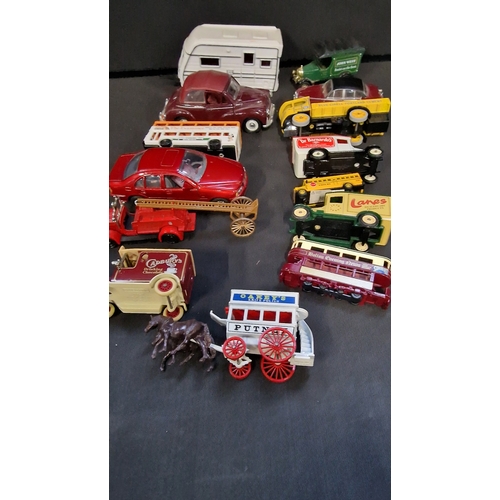 151 - A selection of cars, trams, buses and trucks by Days Gone, Lledo and matchbox.