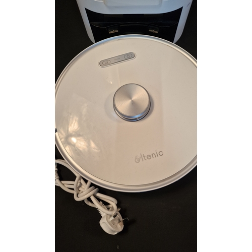 203 - Itenic Robot Vacuum with charger port and cables. Tested for power and working