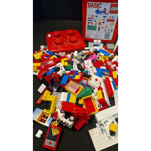 206 - A collection of 1988 Lego pieces, boards and characters