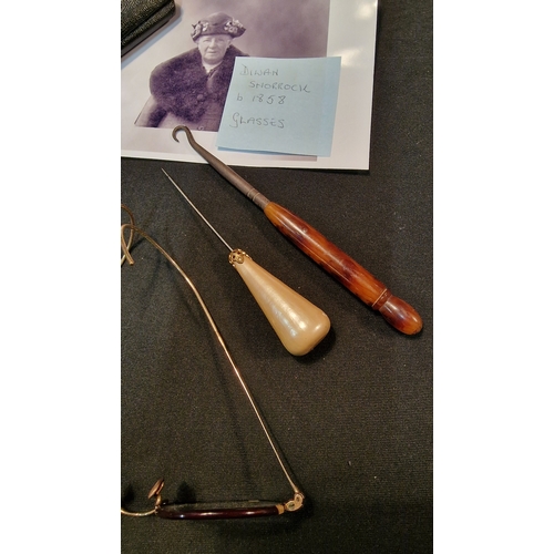 223 - A pair of vintage ladies glasses with amber handled Button hook and hat pin.