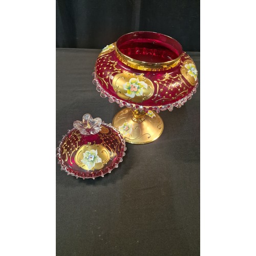 242 - A stunning piece of cranberry glass with gold and floral finish