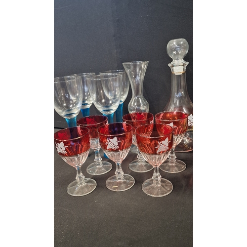 302 - A vintage collection of wine glasses and decanter.  Fidenza Italy glasses and decanter