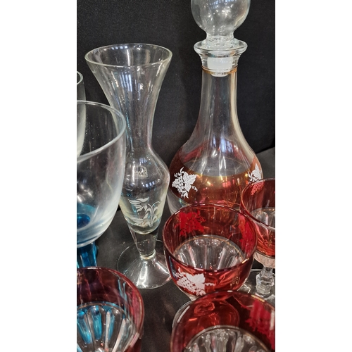 302 - A vintage collection of wine glasses and decanter.  Fidenza Italy glasses and decanter