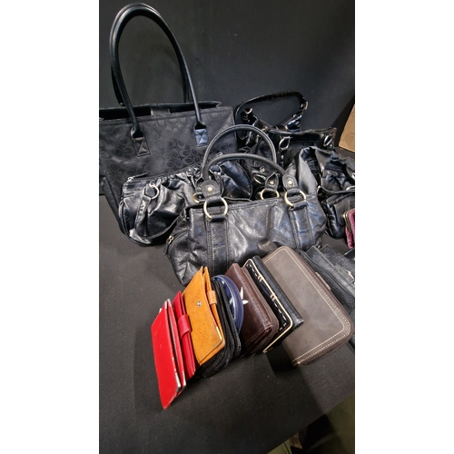 304 - A selection of 6 black handbags and 17 purses.