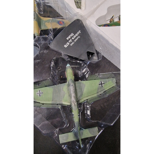 320 - Four collectable.model Planes.  Includes Junkers Ju 87b Stuka, 1940 Battle of Britian Hawker Hurrica... 