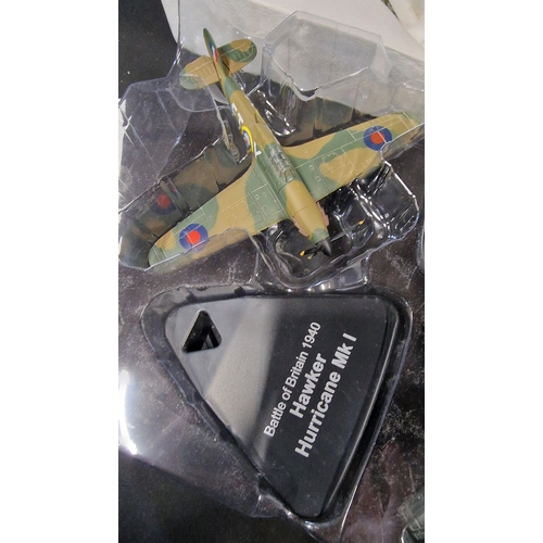 320 - Four collectable.model Planes.  Includes Junkers Ju 87b Stuka, 1940 Battle of Britian Hawker Hurrica... 