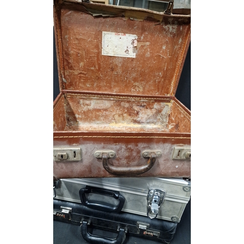 348 - Three case, vintage brown case, metal lockable case and a black brief case.